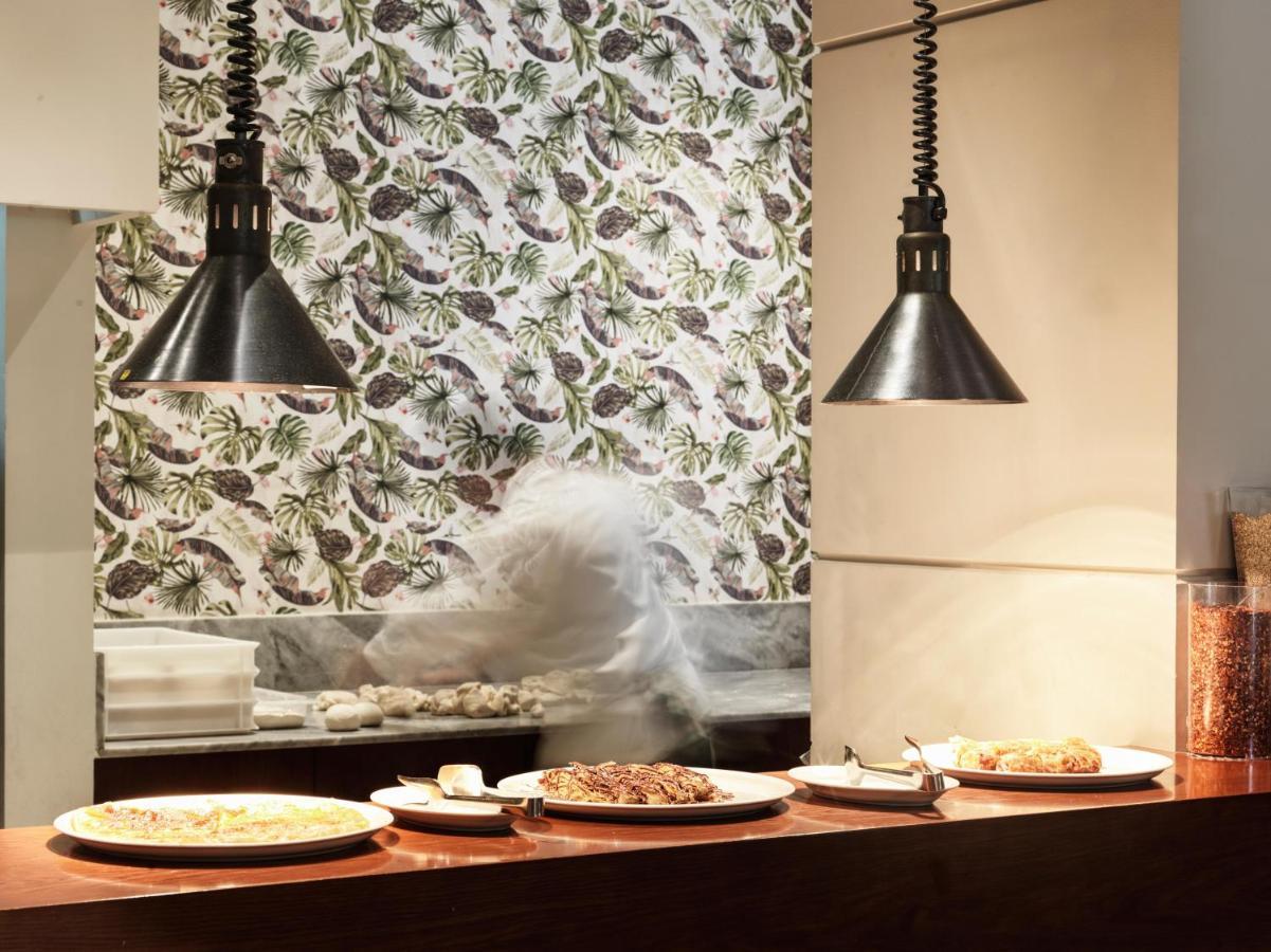 Fanar Hotel & Residences Salalah Exterior photo Open kitchen at a restaurant