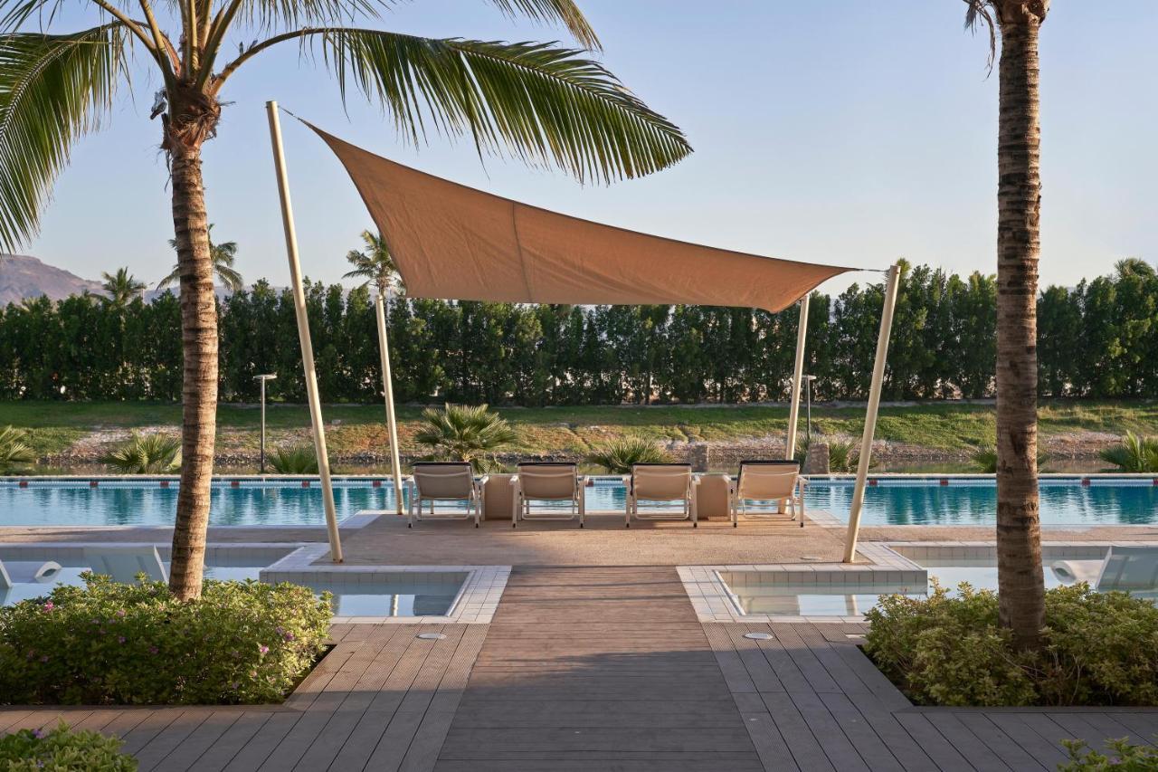 Fanar Hotel & Residences Salalah Exterior photo The swimming pool at the Four Seasons Hotel, The Palm, Dubai